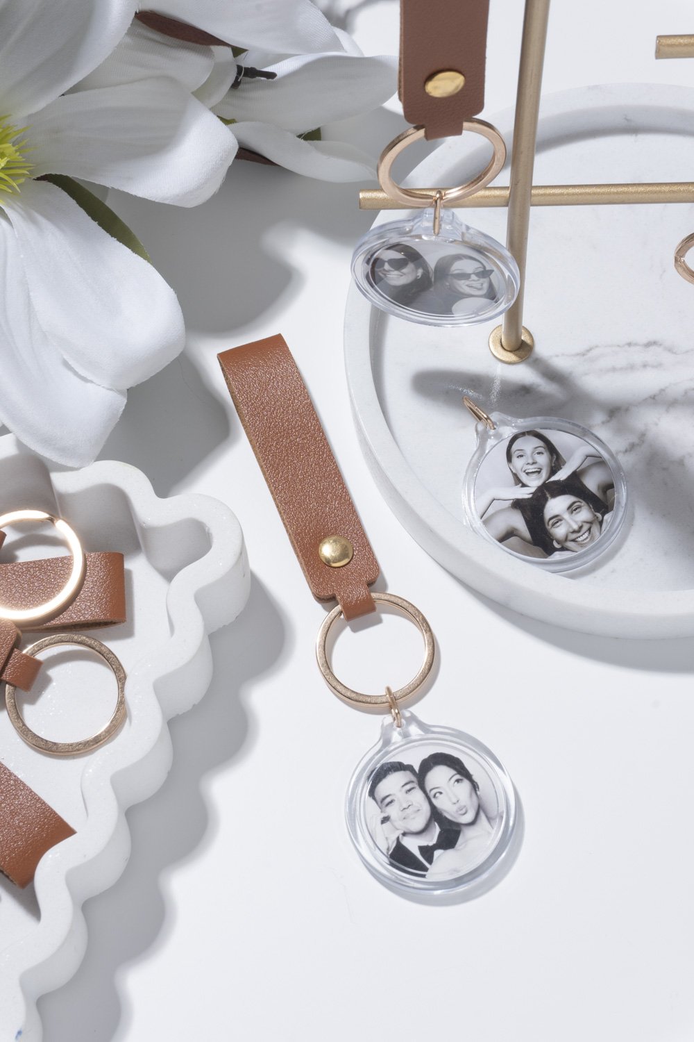 Custom acrylic photo booth keychain with black and white wedding portrait